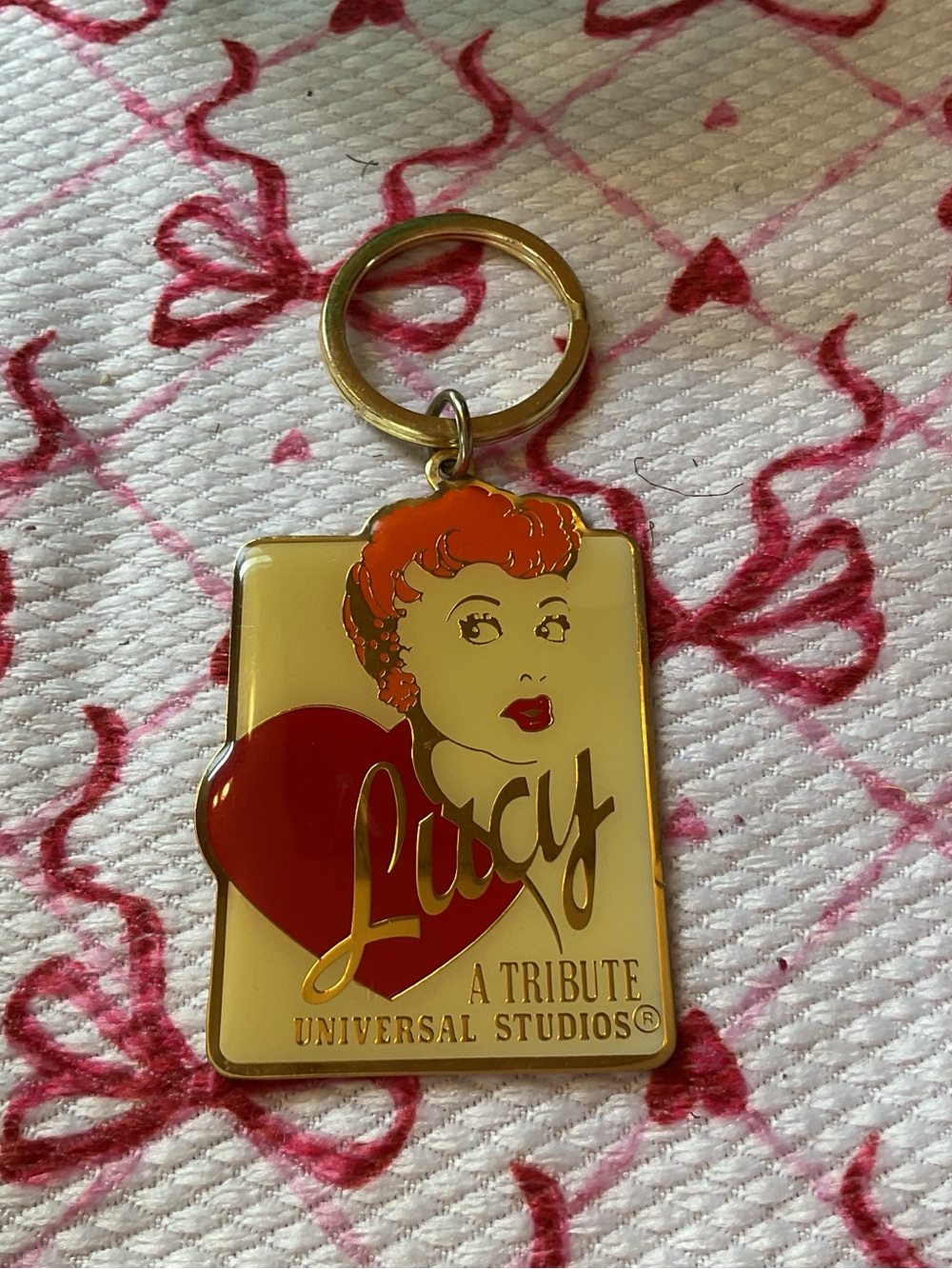 Universal Gold Tone Lucy Keychain with Red Accents